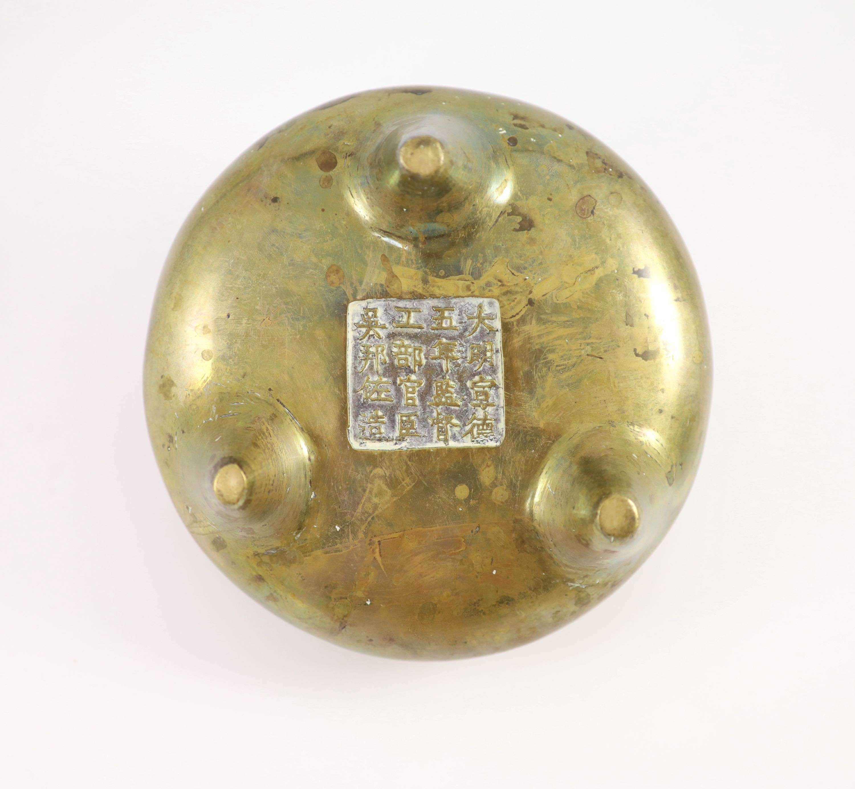 A large Chinese bronze tripod censer, ding, Xuande mark, Qing dynasty, 17cm wide